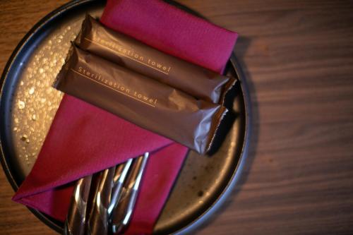 a plate with a piece of chocolate on a table at オーベルジュ カラ 宗像 in Akama