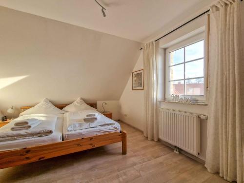 Un pat sau paturi într-o cameră la Deichtraum