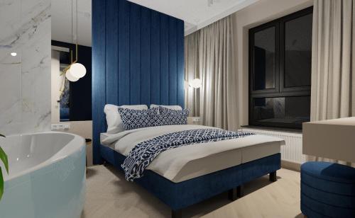 En eller flere senge i et værelse på Apartament LUNA z jacuzzi Premium na Mazurach