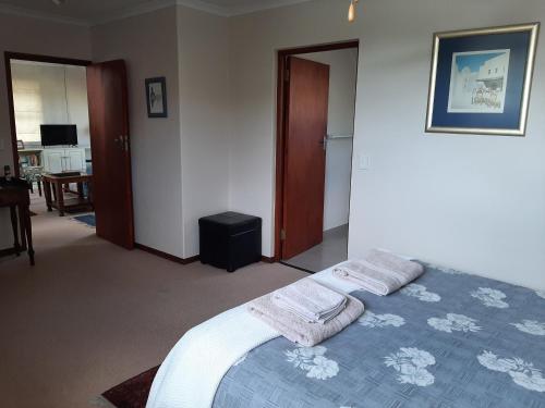 Ένα ή περισσότερα κρεβάτια σε δωμάτιο στο Leisure Island Apartment