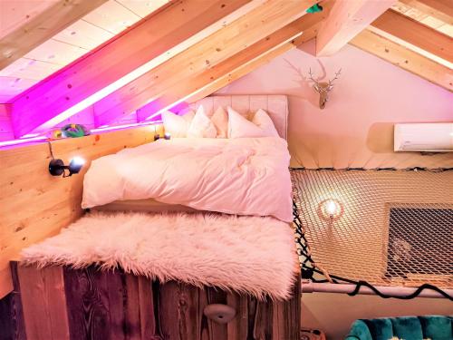 a bedroom with a bed on a platform at DMG - 'The Luxury Penthouse' in Fulpmes
