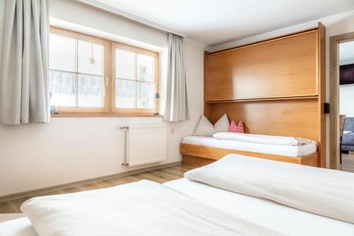 Ένα ή περισσότερα κρεβάτια σε δωμάτιο στο Appartement Arnoldgut