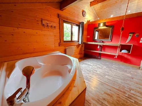 a bathroom with a large white sink in a room at Peaceful chalet near the ski slopes 8 people in Fontrabiouse
