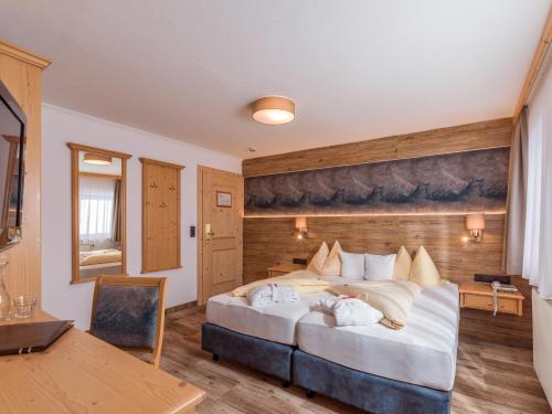 Una cama o camas en una habitación de Hotel Glockenstuhl