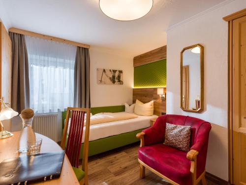 Una cama o camas en una habitación de Hotel Glockenstuhl