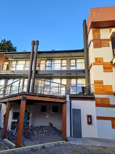 a building with bikes parked in front of it at Depto del Arroyo in San Martín de los Andes