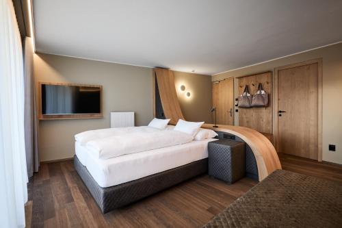 Katil atau katil-katil dalam bilik di Hotel DAS ROYAL in Obereggen