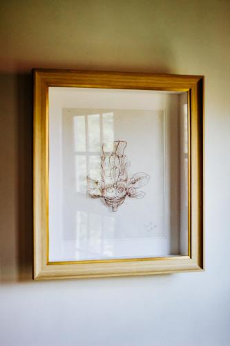 a picture of a chandelier in a picture frame at Kaya Residence Kandy in Kandy