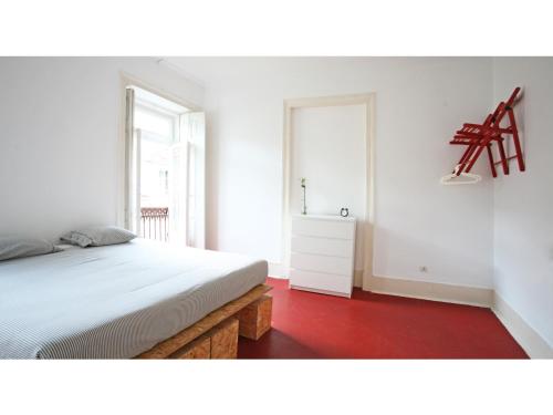 a bedroom with a white bed and a white dresser at Friendly Hills Bairro Alto in Lisbon