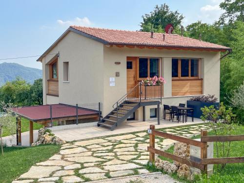 a small house with a patio and a deck at Agriturismo Ai Masi in Combai