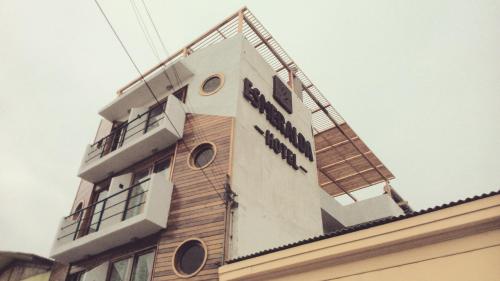 a building with a sign on the top of it at Hotel Esmeralda in Iquique