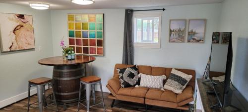 a living room with a couch and a table at 4 Slumber Village - AK Outback in Anchorage