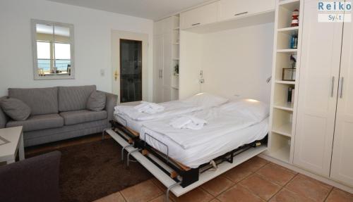 Кровать или кровати в номере 1-78, Seeseite, Haus Metropol, 4 Etage