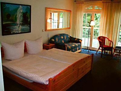 Кровать или кровати в номере Landhotel Gustav