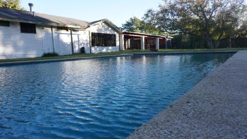 a pool of water in front of a house at Maria Clara in Navidad