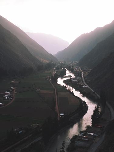 an aerial view of a river in a valley at Starlodge Adventure Suites in Urubamba