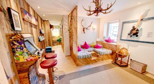 A seating area at DMG - 'Funky First Floor' Unique Mountain Apartment