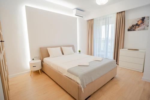 Ein Bett oder Betten in einem Zimmer der Unterkunft Park Panorama Residence - 1BR with Scenic Views