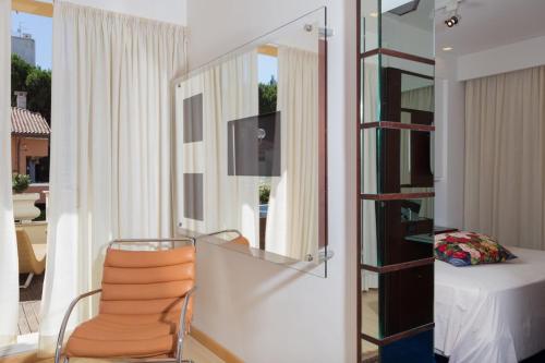 Hotel Luna Riccione e Aqua Spa Only Adults +12にあるテレビまたはエンターテインメントセンター