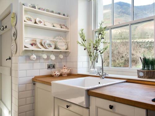 a kitchen with a sink and a window at 2 Bed in Threlkeld SZ082 in Threlkeld