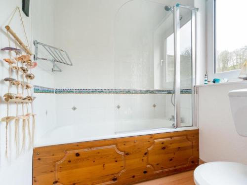 a bathroom with a bath tub and a toilet at 2 Bed in Borrowdale SZ068 in Rosthwaite