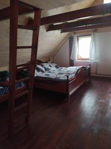 a bedroom with two bunk beds and a window at Chata Naděje in Raspenava