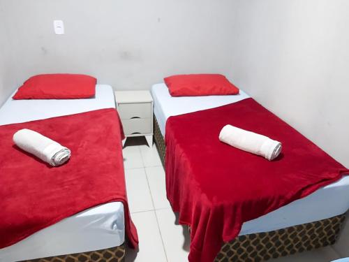 Een bed of bedden in een kamer bij Casa de 2 Quartos no Centro