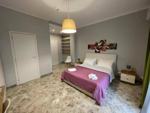 Ένα ή περισσότερα κρεβάτια σε δωμάτιο στο ROOM 110 BARI -guesthouse-