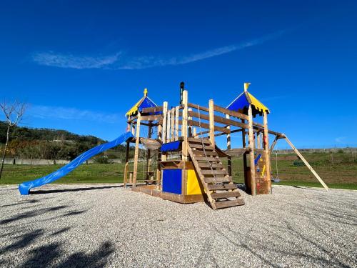 a playground with a slide and a slideintend at Casa Martins Country Apt, No.6 in Freiria