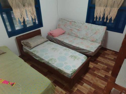 En eller flere senge i et værelse på Chácara Rancho da Felicidade