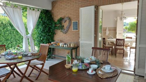 a dining room with a table and chairs at Aura Relais in Numana