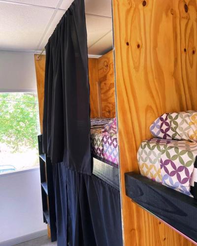 a bedroom with two bunk beds in a trailer at Alfar Hostel in Mar del Plata