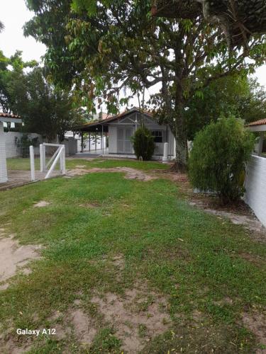 a yard with a soccer goal in front of a house at Casa de Praia da LOMBA in Florianópolis
