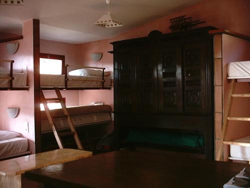a bedroom with a bed and a desk at La Coquille Napoléon in Saint-Jean-Pied-de-Port