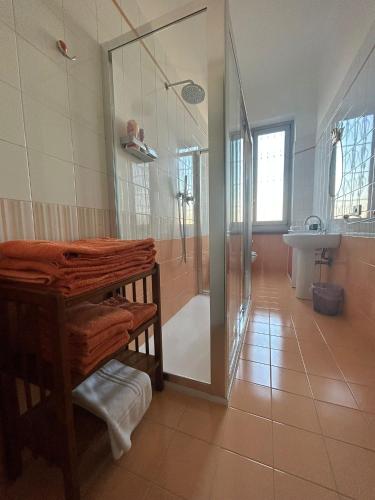 a bathroom with a shower and a toilet and a sink at Gambara Apartment in Milan