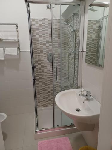 a bathroom with a sink and a shower at Hotel Costa in Bari