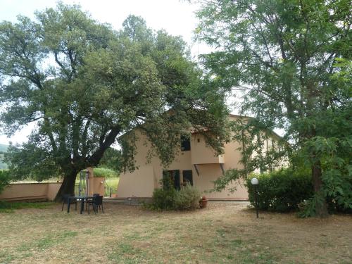 a house with two trees in front of it at Al Vecchio Leccio in Pistoia