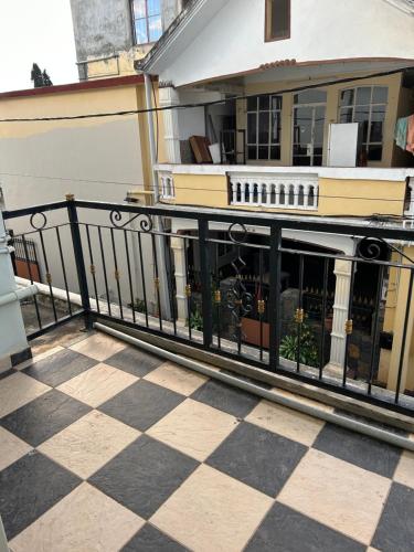 a balcony of a house with a black railing at VMKY apartment in Triolet