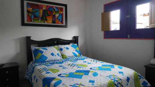 Cama o camas de una habitación en Hostal Palmas De Cocora