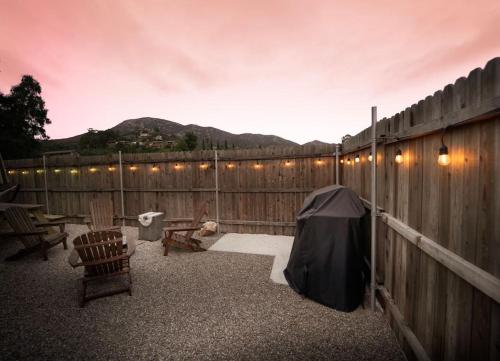 a patio with a fence and a table and chairs at TinyHome at the Sanctuary in Lakeside
