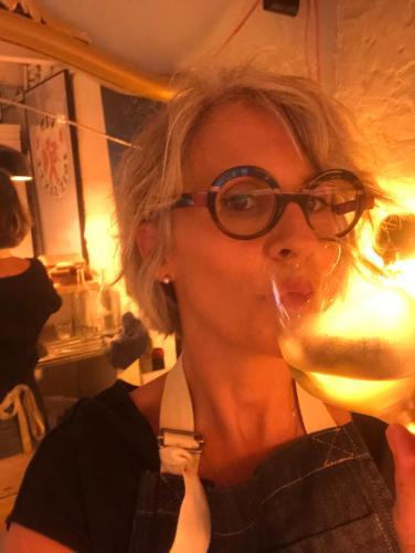 a woman with glasses drinking a glass of wine at B&B Vigne Vierge in Aigne