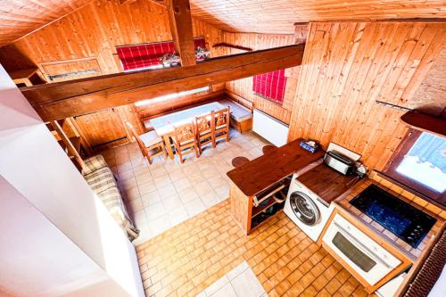 an overhead view of a kitchen and dining room at Snowflake cottage with garden in Chamonix