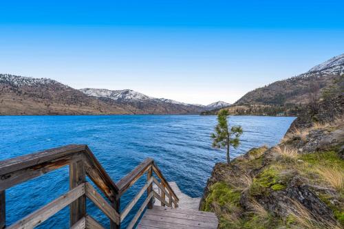a view of a lake with mountains in the background at Deep Water Cabin in Hollywood Beach
