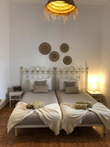 a bedroom with a bed with two pillows on it at Casita Volcan Lanzarote in Ye