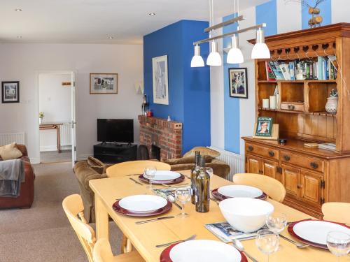 a dining room with a table and chairs at Seafield in Ballymoney Cross Roads