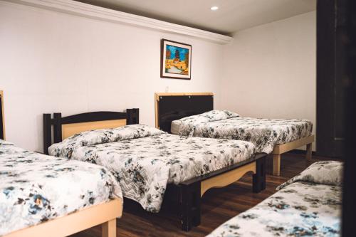 Ένα ή περισσότερα κρεβάτια σε δωμάτιο στο Hotel Raíces Casona Real