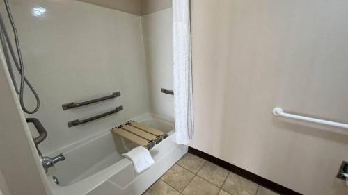 a bathroom with a shower and a bath tub at Motel 6 Georgetown, SC Marina in Georgetown