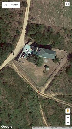an aerial view of a house in a field at Zeus Estate Guesthouse in Grays Hill