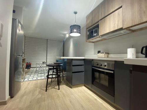 Η κουζίνα ή μικρή κουζίνα στο Depto. Pucón, terraza, piscina y estacionamiento