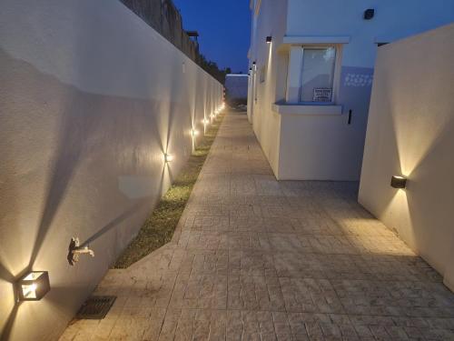 a hallway with lights on the side of a building at Chacabuco Aparts in Chacabuco